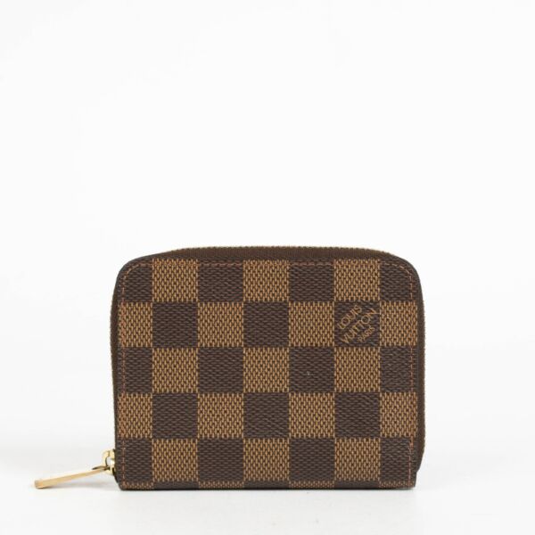 Authentic pre-loved Louis Vuitton Damier Ebene Zippy Coin Purse on Labellov.com
