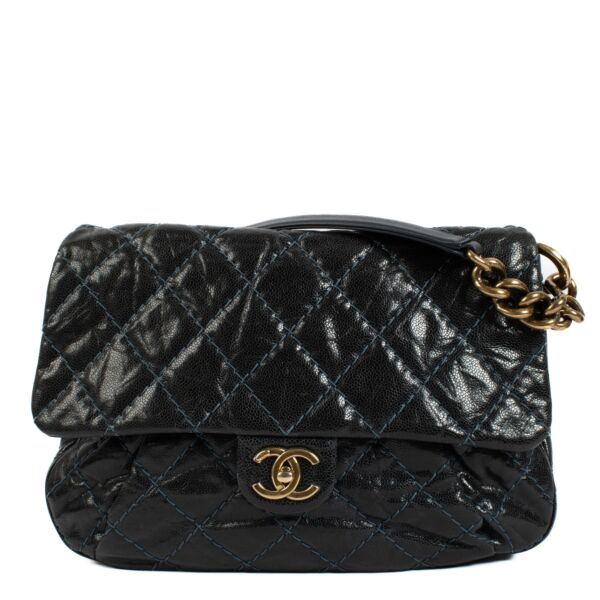 Chanel navy blue calfskin bag with light blue stitching, gold hardware, short shoulder strap, and long crossbody strap. Shop now on Labellov.com. 