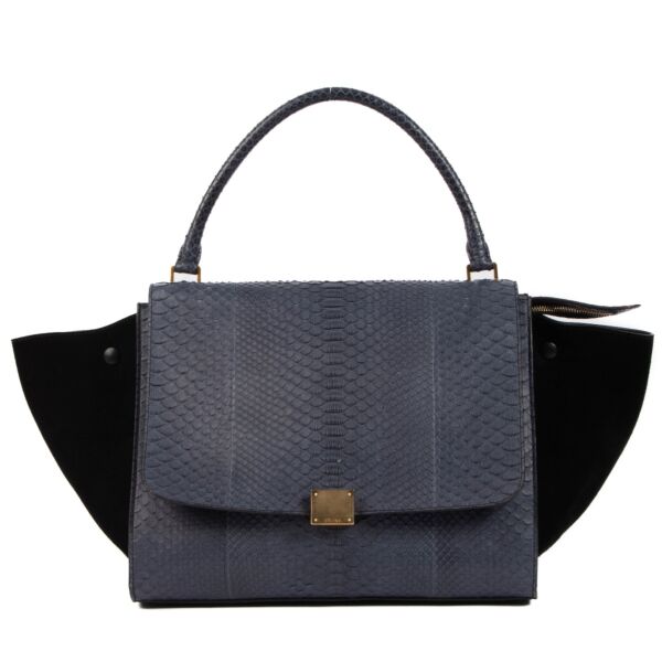 Shop safe online at Labellov in Antwerp, Brussels or Knokke this 100% authentic second hand Celine Blue Python Black Suede Medium Trapeze Bag