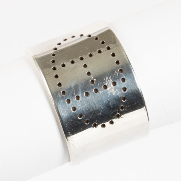 Hermès Eclipse silver bracelet with perforated H design at Labellov.com