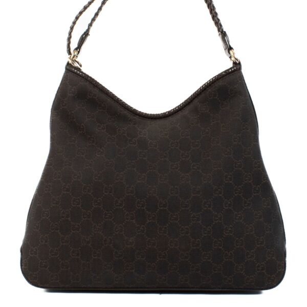 Shop 100% authentic Gucci Brown Nylon Monogram Hobo Bag at Labellov.com. 