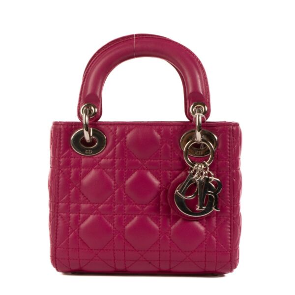 Shop safe online at Labellov in Antwerp, Brussels and Knokke this 100% authentic second hand Christian Dior Fushia Lambskin Mini Lady Dior