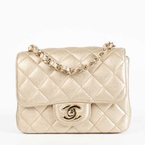 Chanel Gold Quilted Square Mini Flap Bag in metallic lambskin leather with gold hardware and chain strap, in very good pre-loved condition, available at Labellov.com