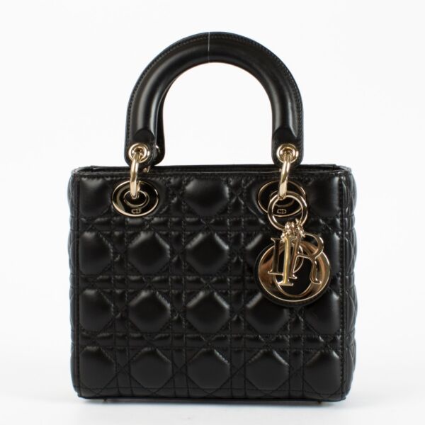 Christian Dior Small Lady Dior Bag in black lambskin with gold hardware and red interior, full set with care booklet and receipt at Labellov.com