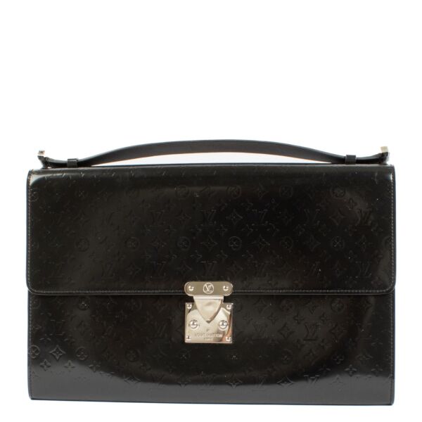 Vintage Louis Vuitton Black Anouchka GM handbag  in black monogram-embossed patent leather with silver-tone hardware and push-release closure. Buy now on Labellov.com.