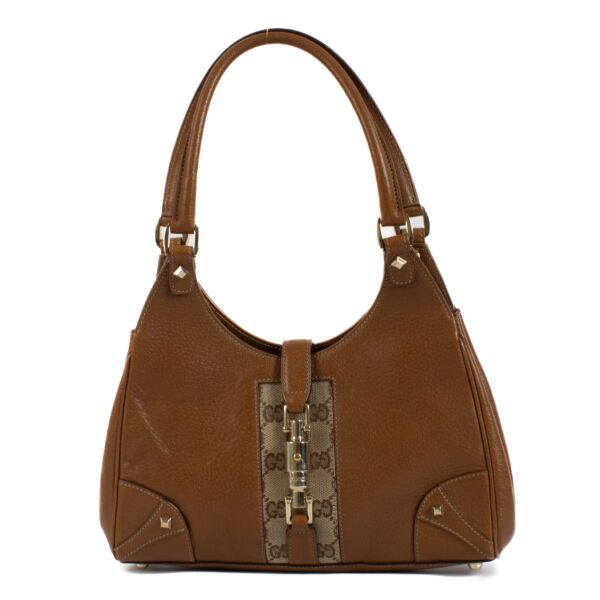 Shop 100% authentic Gucci Brown Leather Monogram Jackie Hobo Small Bag at Labellov.com. 