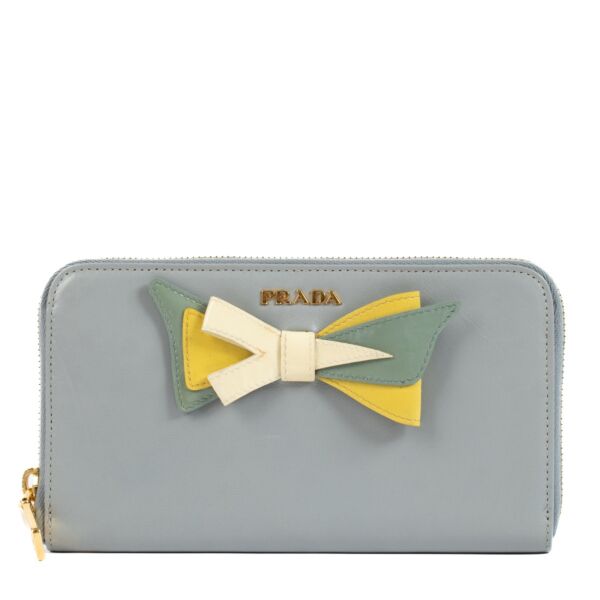 Shop safe online at Labellov in Antwerp, Brussels and Knokke this 100% authentic second hand Prada Blue Leather Bow Zip Around Wallet