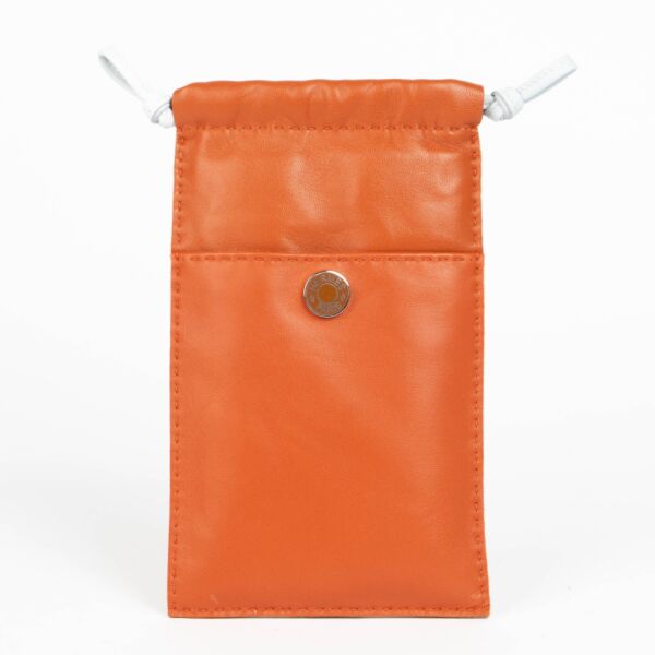 Authentic pre-loved Hermès Cornaline/Bleu Brume Etui Telephone Pilo on Labellov.com