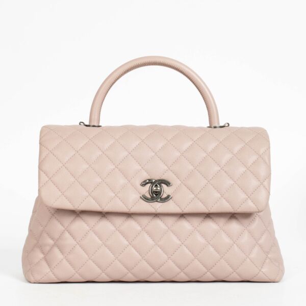 Authentic pre-loved Chanel Pink Caviar Large Coco Handle Bag on Labellov.com