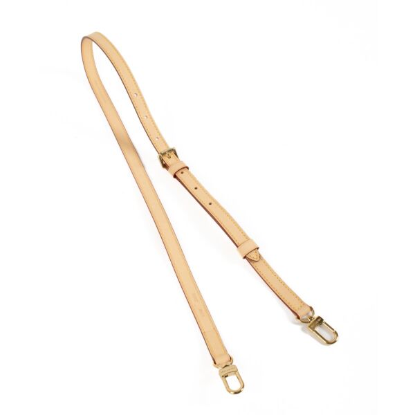 Louis Vuitton Adjustable Shoulder Strap 16mm in natural Vachetta leather with gold-tone hardware, featuring an adjustable length for crossbody or shoulder wear. Shop now on Labellov.com.