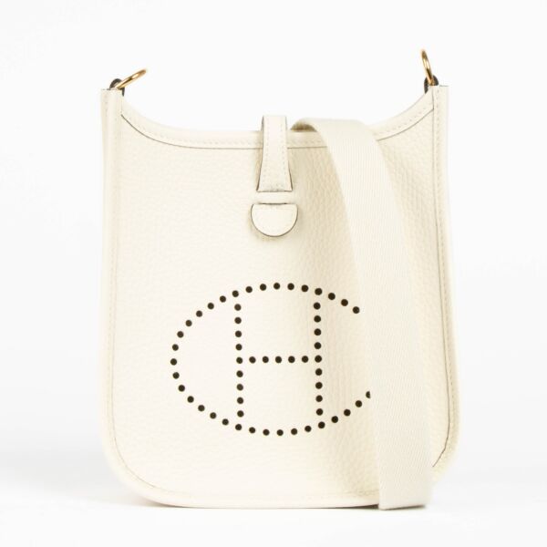 Shop this 100% authentic Hermès Evelyne 16 Craie Clemence GHW Bag at labellov.com