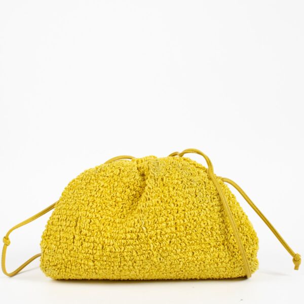 100% authentic preloved Bottega Veneta Yellow Raffia Mini Pouch on labellov.com