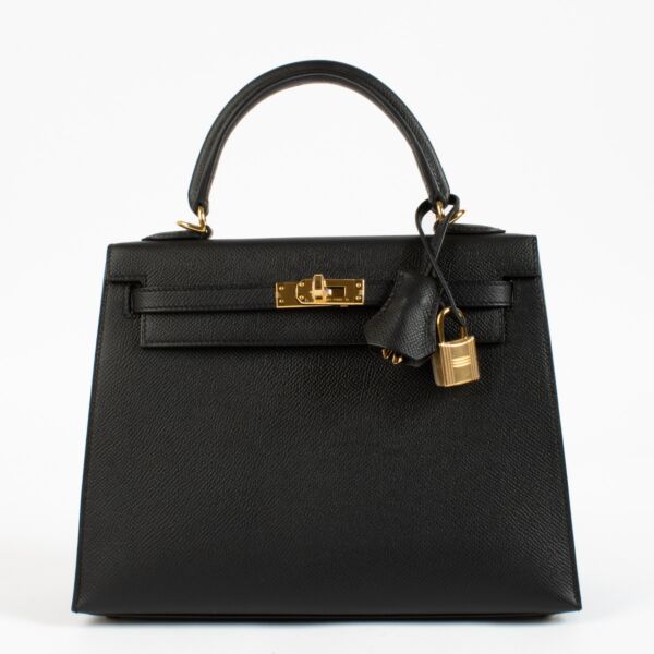 Discover the highly coveted Hermès Kelly 25 Sellier in Black Epsom leather with Gold Hardware, a timeless icon of French luxury. Crafted from structured Epsom leather, this elegant handbag features the classic Sellier silhouette, gold-plated hardware, and