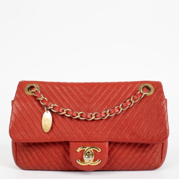 Authentic pre-loved Chanel Red Chevron Wrinkled Goatskin Medallion Mini Flap Bag on Labellov.com