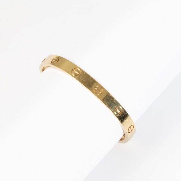 Preloved yellow gold Cartier love bracelet in size 16 on Labellov.com