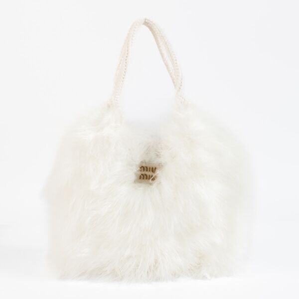 Shop 100% authentic second hand Miu Miu IVY Crochet Handbag With Feathers on Labellov.com