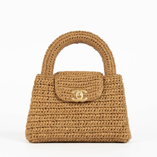 Shop safe online at Labellov in Antwerp, Brussels and Knokke this 100% authentic second hand Chanel Dark Beige Braided Raffia Kelly Nano Bag