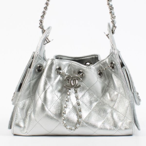 Authentic second hand luxury designer vintage brand new Chanel Metallic Silver Chanel 25 Mini Bag on www.labellov.com