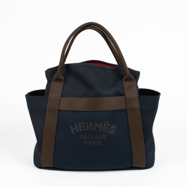 Hermès Bleu Navy Feu Toile Sac De Pasnage Groom Top Handle Bag for the best price at Labellov secondhand luxury 