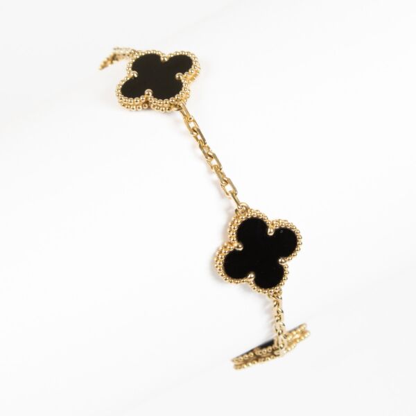 Authentic Van Cleef & Arpels Vintage Alhambra bracelet in 18 K yellow gold with five onyx motifs at Labellov.com.