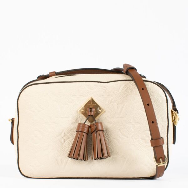 Authentic pre-loved Louis Vuitton Cream Monogram Empreinte Saintonge Bag on Labellov.com