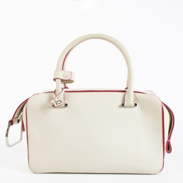 Delvaux White Cool Box MM in smooth white leather with pink edge detailing and silver-tone hardware, in good pre-loved condition, available at Labellov.com