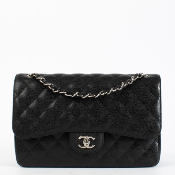 Chanel Black Caviar Large Classic Handbag with silver-tone hardware and burgundy leather interior available at Labellov.com