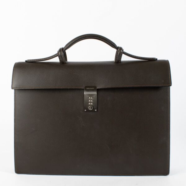 Delvaux brown leather briefcase showing silver-tone combination-lock clasp.