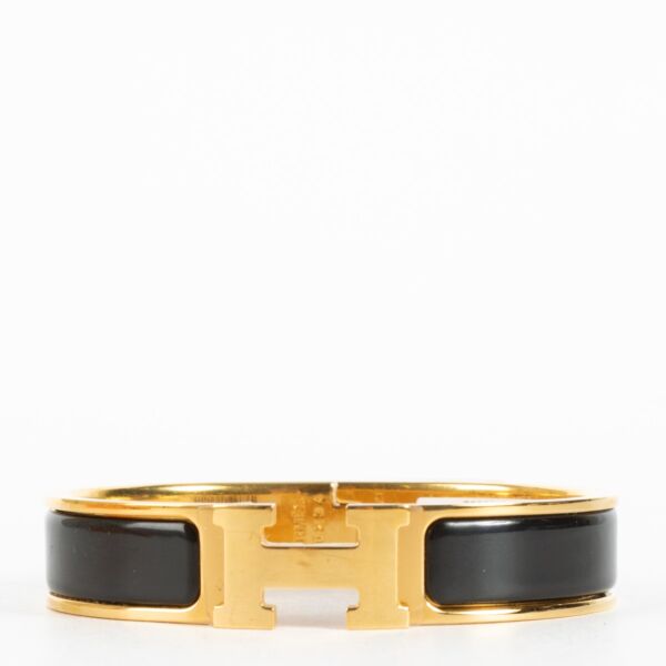 Discover the Hermès Black Enamel Clic H Bracelet with gold hardware at Labellov.com — iconic, elegant and authenticated. Shop luxury accessories online.