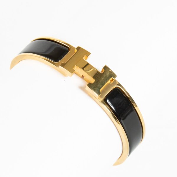 Discover the Hermès Black Enamel Clic H Bracelet with gold hardware at Labellov.com — iconic, elegant and authenticated. Shop luxury accessories online.