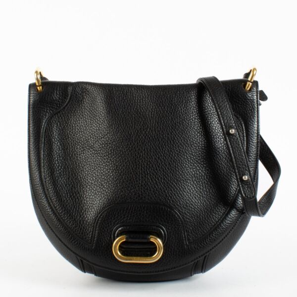 Delvaux black leather crossbody bag with gold hardware and saddle silhouette at Labellov.com