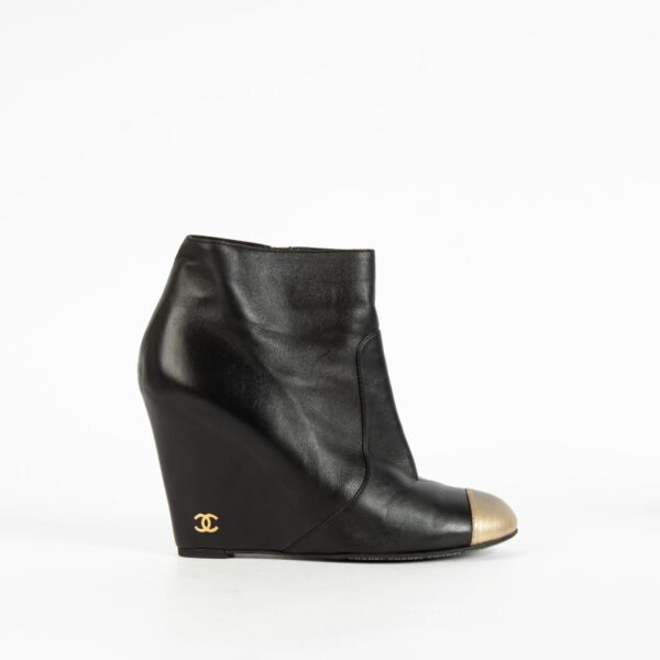 Shop the authentic Chanel Black/Gold Ankle Boots Size 37.5 on Labellov.com.