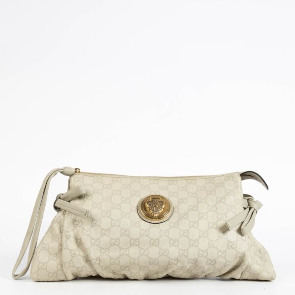 Authentic pre-loved Gucci Beige Leather Guccissima Large Hysteria Clutch on Labellov.com