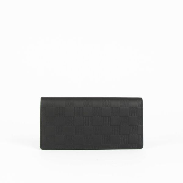 Shop this 100% authentic Louis Vuitton Black Damier Infini Brazza Wallet at Labellov.com