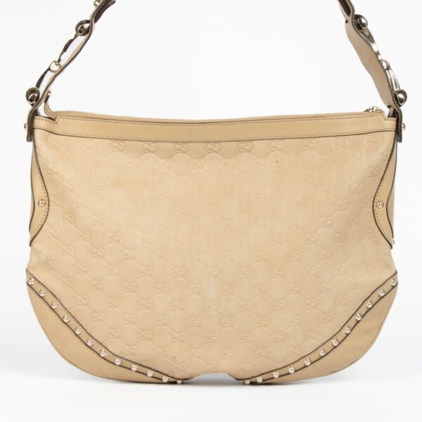 Authentic pre-loved Gucci Beige Guccissima Pelham Medium Hobo Crossbody Bag on Labellov.com