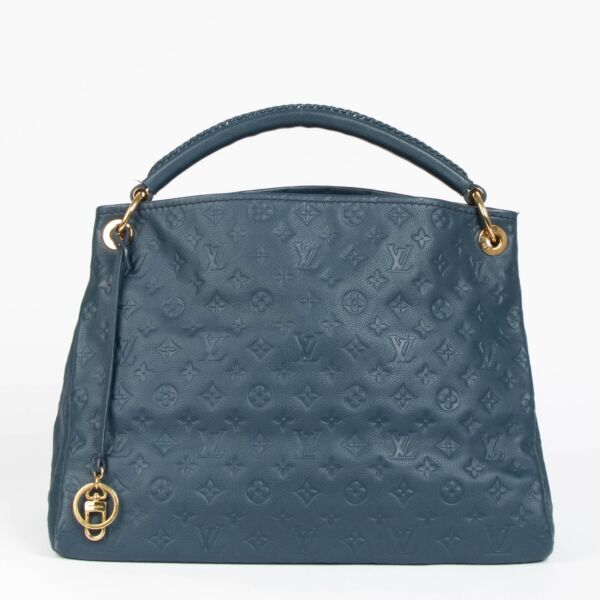 Authentic pre-loved Louis Vuitton Blue Monogram Empreinte Artsy MM Shoulder Bag on Labellov.com