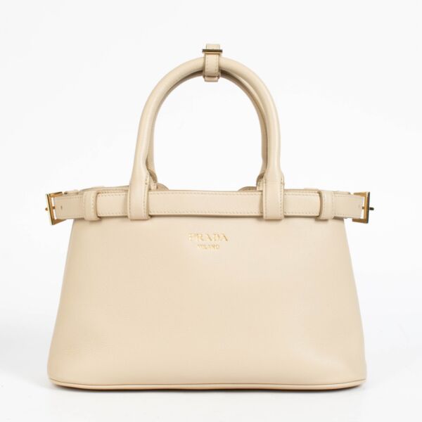 Authentic pre-loved Prada Travetine Leather Small Buckle Double Belt Bag on Labellov.com