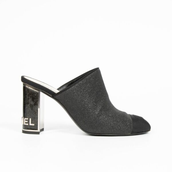100% authentic Chanel Black Glitter Cap Toe Mules in size 39 with subtle glitter finish and iconic cap toe design.