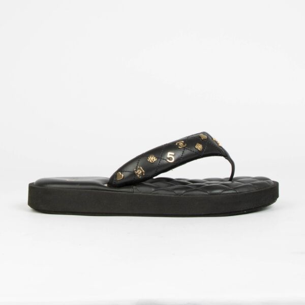 Authentic pre-loved Chanel Black Quilted Charms Thong Sandals -Size 38.5 on Labellov.com