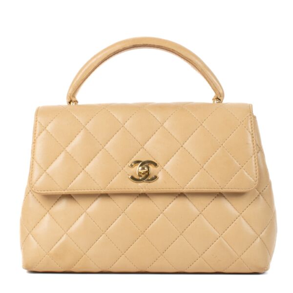 Shop 100% authentic Chanel Beige Lambskin Vintage Coco Handle Bag at Labellov.com.