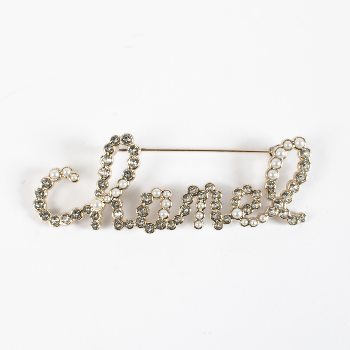 Chanel 19K Silver Logo Brooch ○ Labellov ○ Buy and Sell