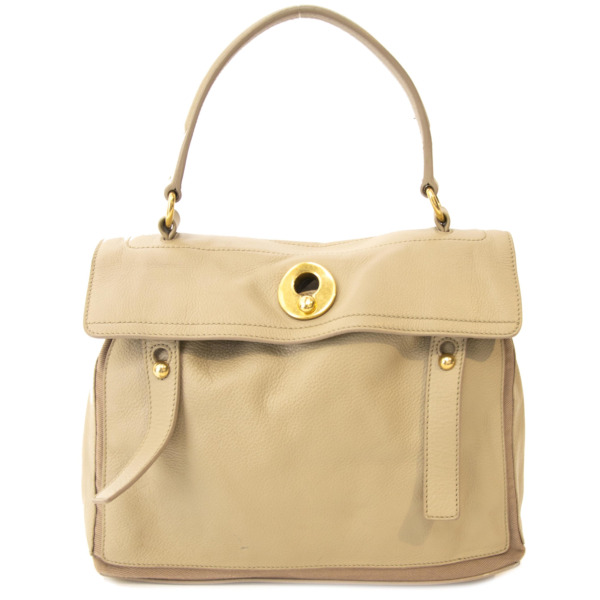 top handle beige bag